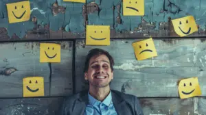 man lying in the floor with emojis